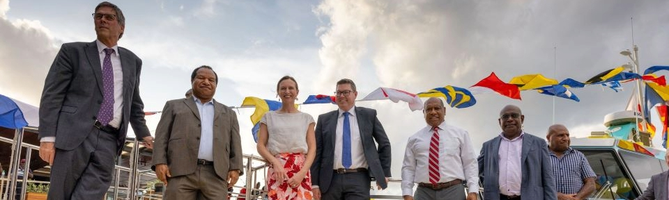 An AIFFP funded pilot boat, purpose-built for Papua New Guinea Ports Corporation Ltd, is launched in a ceremony attended by Minister for International Development and the Pacific, the Hon Pat Conroy MP (fourth from left), November 2022.