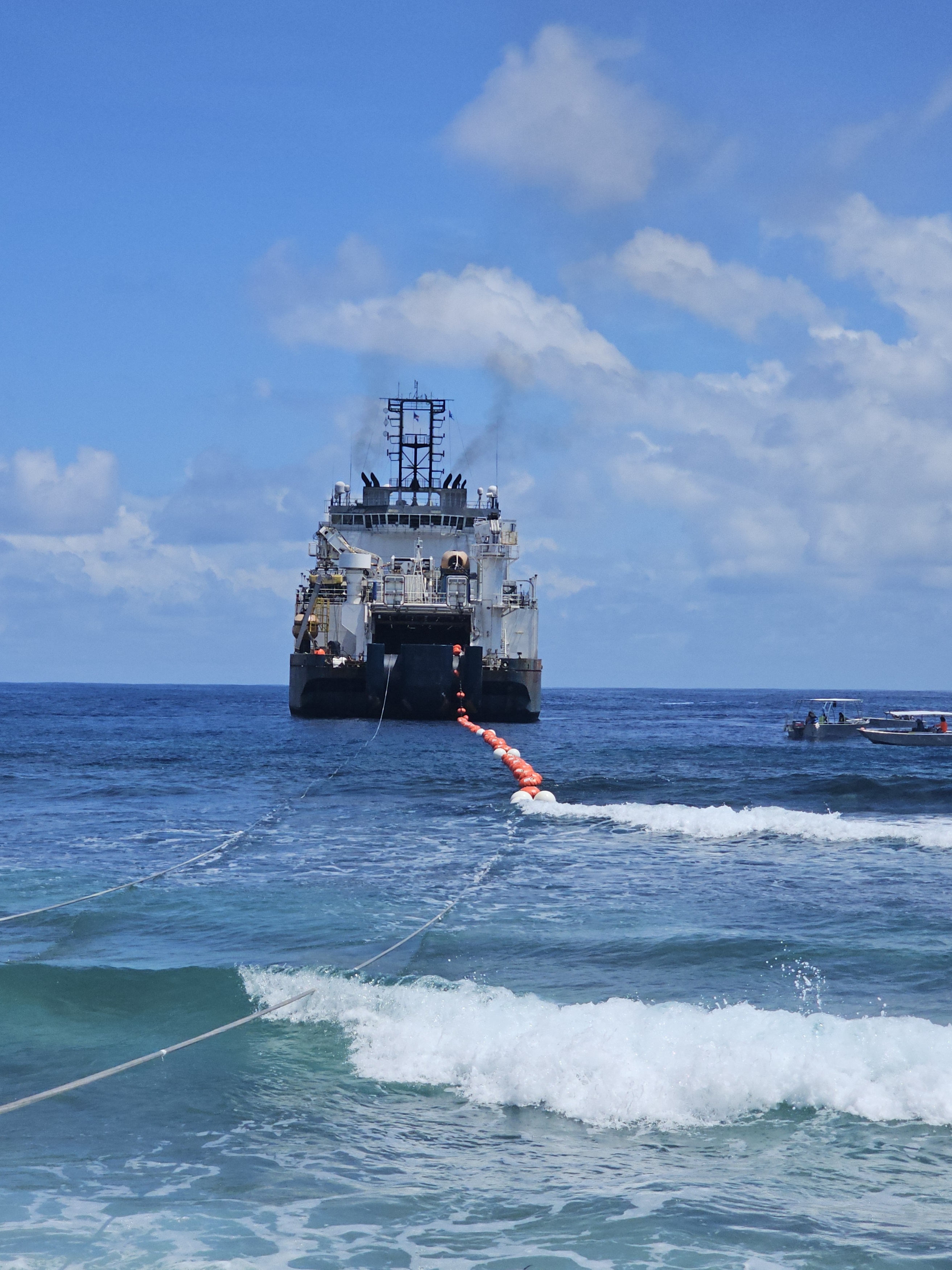 Main lay vessel in action landing Tuvalu Vaka cable. 