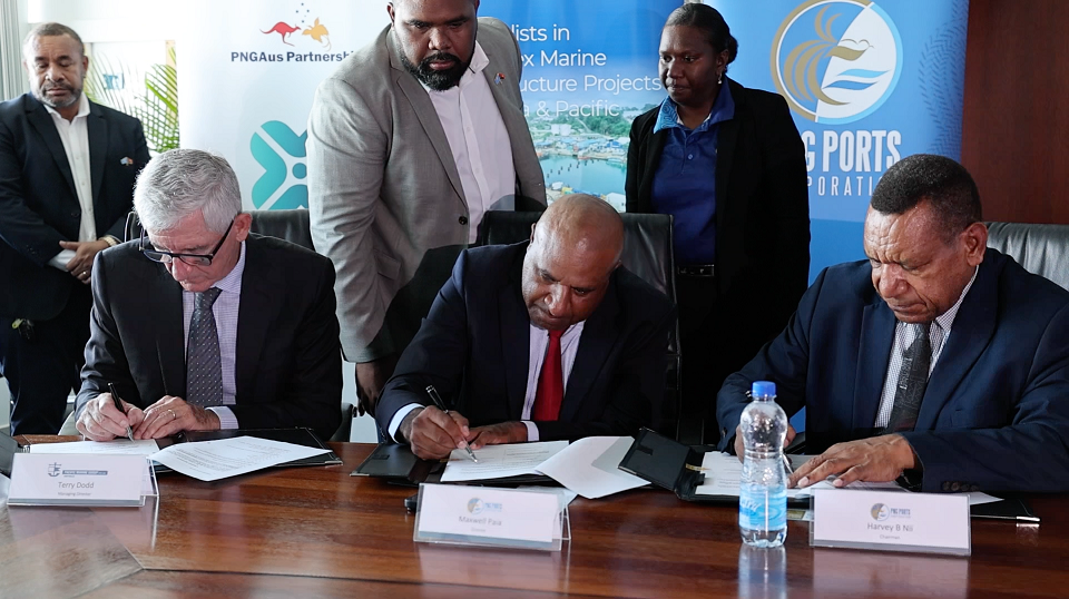 Contract signing by Pacific Marine Group MD Terry Dodd, PNG Ports Ltd Director Maxwell Paia and Chairman Harvey Nii